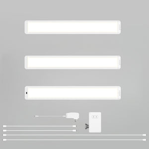 Three Artika-USA Maestro under cabinet LED light 3CCT bars, a power adapter, switch, mounting bracket, and four connecting cables are neatly arranged on a light gray background.