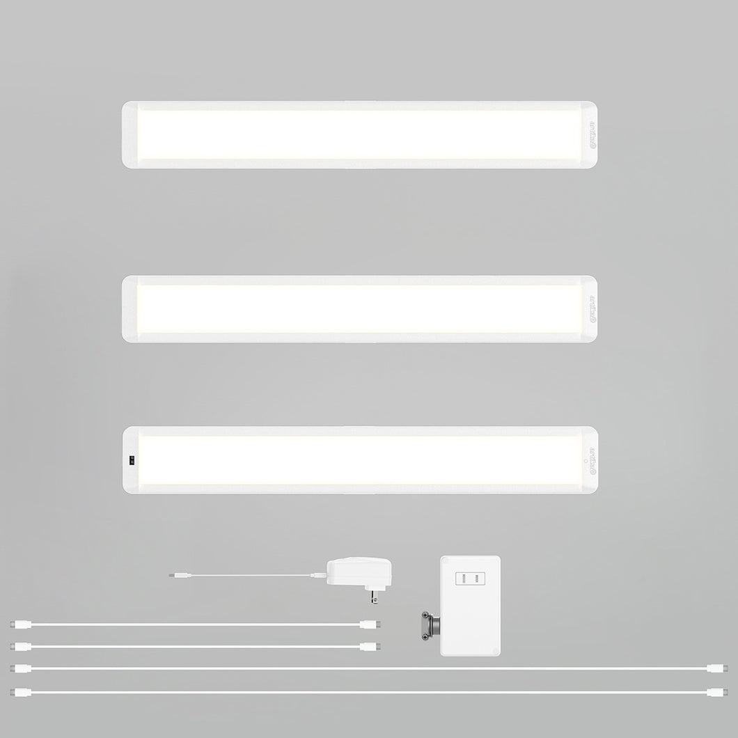 Three Artika-USA Maestro under cabinet LED light 3CCT bars, a power adapter, switch, mounting bracket, and four connecting cables are neatly arranged on a light gray background.